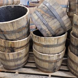 Whiskey planters stacked up on a palette 3 high